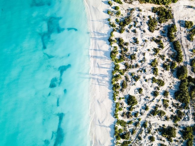 Drone view of the beaches of Turks and Caicos where RE/MAX Real Estate Group sells prime real estate